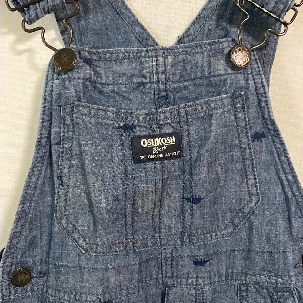 OshKosh B'gosh Classic Blue Denim Overalls with tiny dinosaurs wear long or roll